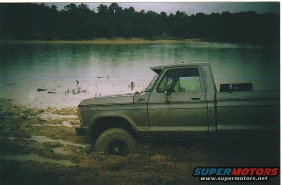 1979 Ford F-250 side view, stuck in mud by water