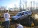 1978 Ford Bronco - A silver SUV navigates a muddy off-road course with a driver visible.