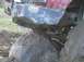 1978 Ford Bronco - This red vehicle appears to be stuck on a large rock, a prominent aftermarket bumper and winch system.