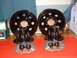 1994 Jeep YJ - Vehicle brake components including wheels, rotors, and calipers are laid out on a red surface.