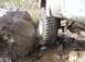 1978 Ford Bronco - Vehicle tire stuck on a rock during off-road driving.