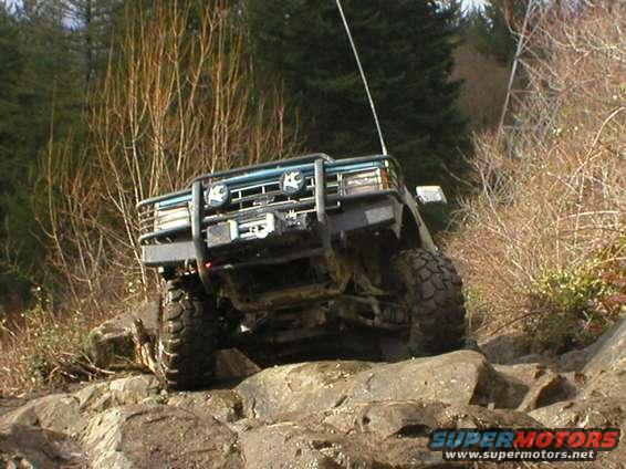 Off-road vehicle with winch on rocky terrain