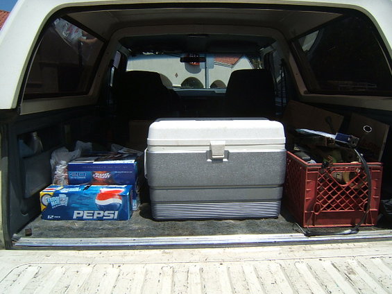Truck bed with cooler, Pepsi cases, and red crate