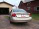 2000 Ford Taurus - Rear view of a gold 2000 Ford Taurus, identified by its 'Taurus SE' badging and the 'Quality Checked' license plate frame.