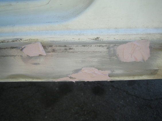 Rock slider with pink filler material applied in patches