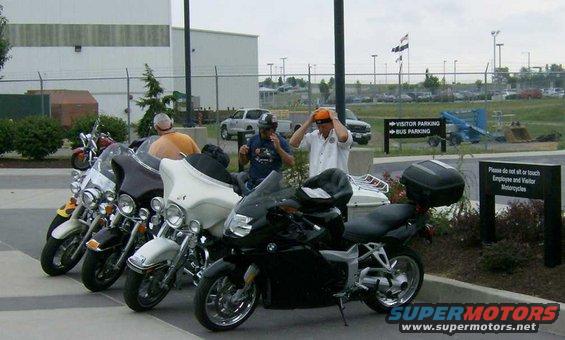 Black BMW motorcycle parked in front of other motorcycles
