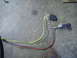 1984 Ford Bronco - Automotive wiring harness and sensor components on a concrete surface.