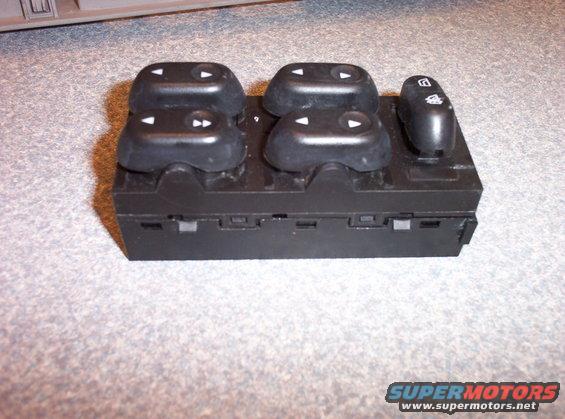 Black power window switch assembly with four window control buttons and one lock button