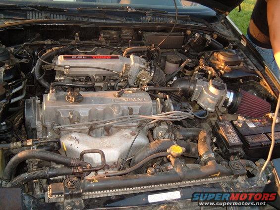 Engine bay with 2.5L TURBO and 16 VALVE labels visible on engine components
