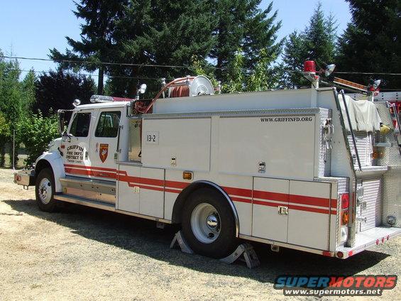 White fire truck with red stripes, labeled "GRIFFIN FIRE DEPT. DISTRICT 13"