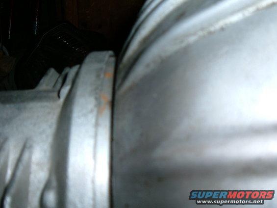 Close-up of a metal engine component with a flange