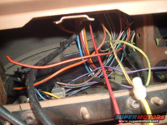 Vehicle wiring harness with many colored wires and connectors visible