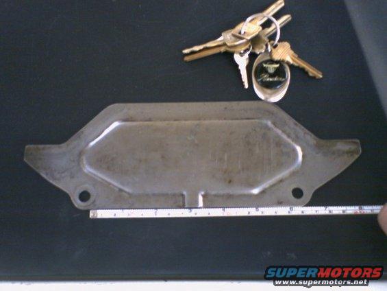 Metal dust cover plate with a keychain showing 'Ranchero' text
