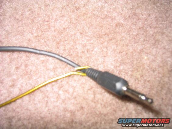 wire-wrapped-around-coathanger.jpg wrap a wire around the coathanger and push it through one of the holes in the carpet