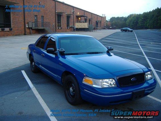Blue 1998 Ford Crown Victoria parked in lot