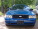 1998 Ford Crown Victoria - Front view of a blue 1998 Ford Crown Victoria parked outdoors.