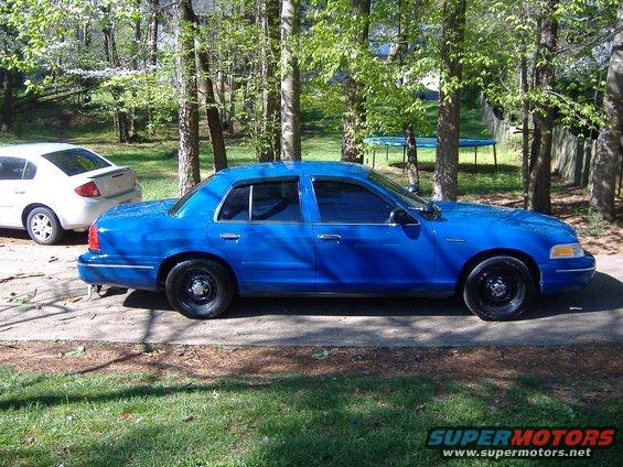 Blue 1998 Ford Crown Victoria sedan, side view