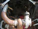 1969 Ford Mustang - Custom turbocharger and exhaust piping installation is visible in this underside view.