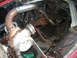 1969 Ford Mustang - Custom turbocharger and exhaust piping installation in an engine bay.