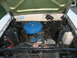 1966 Ford Ranchero - Engine bay view of a 1966 Ford Ranchero, showing the V8 engine and air cleaner assembly.