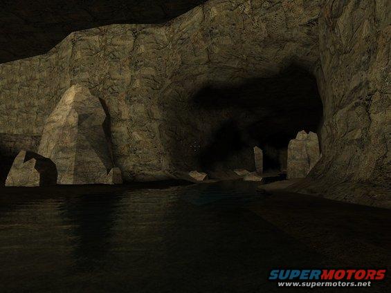 Cave interior with water and rock formations. Supermotors.net logo visible
