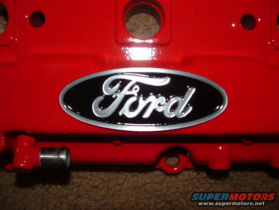 Red Ford valve cover with black oval Ford emblem