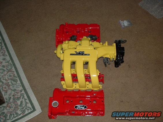 Red Ford valve covers and yellow V6 intake manifold with 'V6 RAMPANT KLZE' text