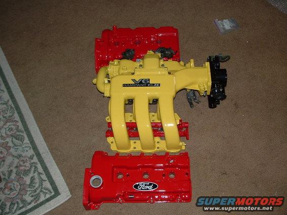 Red Ford valve cover and yellow V6 intake manifold with "Rampant KLZE" text