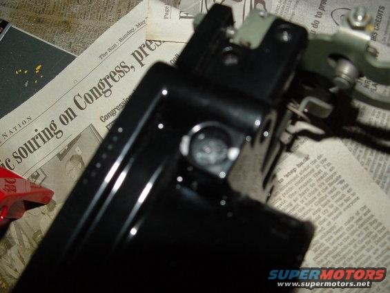 Black automotive part on newspaper with headline 'ic souring on Congress, pres.'