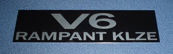 Black rectangular badge with silver text 'V6 RAMPANT KLZE'
