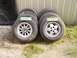 1995 Jeep YJ - Four Jeep wheels and tires are displayed, two marked as sold, next to a black vehicle door.