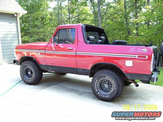 Red 1979 Ford Bronco with FX4 off-road badging, parked in a driveway