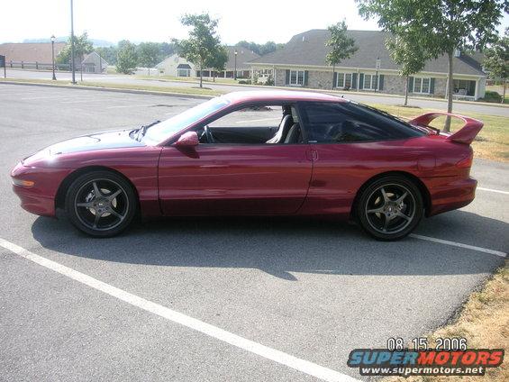 1993 Ford Probe GT coupe, side view, red paint, aftermarket wheels