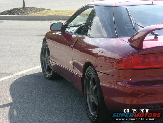 Maroon 1993 Ford Probe GT coupe, rear 3/4 view, showing spoiler and alloy wheels