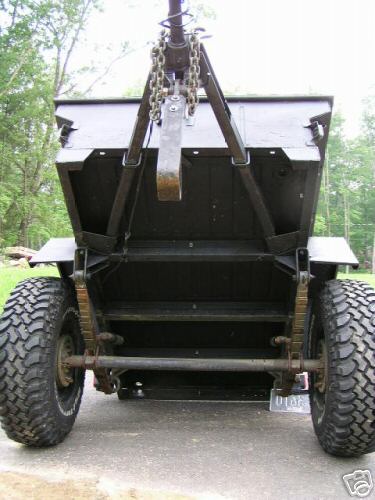 Trailer chassis rear view with large off-road tires and suspension