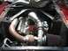 1969 Ford Mustang - Custom turbo build in a 1969 Ford Mustang engine bay, a large turbocharger and extensive piping.