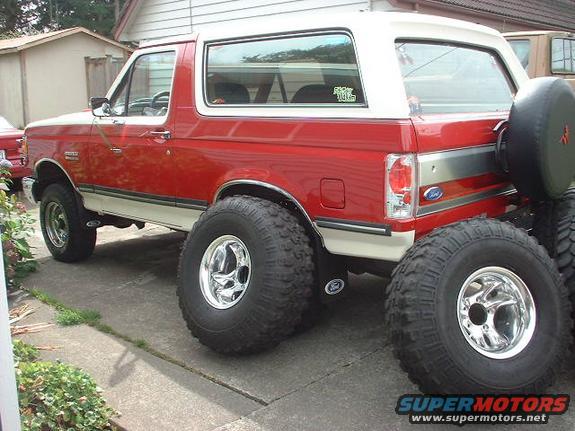 with 36's leaning up against the truck