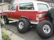 1989 Ford Bronco - with 36's leaning up against the truck