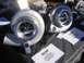 1969 Ford Mustang - Two Precision turbochargers are displayed with product information sheets and a cell phone.