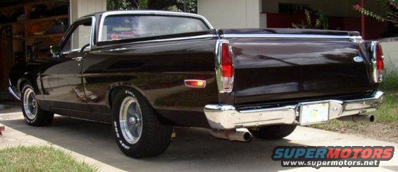 Dark brown Ford Ranchero parked in a driveway, rear view