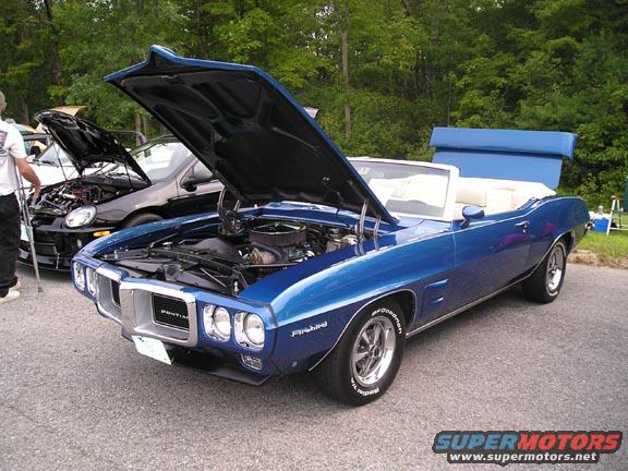 Blue 1969 Pontiac Firebird convertible, front 3/4 view, hood open