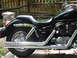 2004 Honda Shadow Sabre VT 1100 - Side view of a black 2004 Honda Shadow Sabre VT 1100 motorcycle with chrome accents.