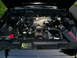 2003 Mercury Marauder - The engine bay of a car is shown with the hood open, revealing the engine components and wiring.