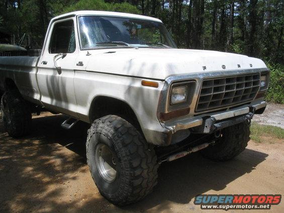 White 1979 Ford F-Series pickup truck with large tires, front quarter view