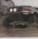1984 Ford Bronco - Modified 1992 Ford Bronco with custom front bumper and lights navigating rough terrain.