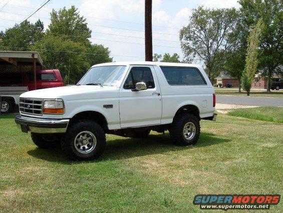White 1993 Ford Bronco parked on grass