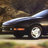Black car front corner with distinctive wheel design