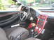 1993 Ford Probe - The interior of a red 1993 Ford Probe is visible, aftermarket gauges and a modified center console.