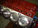 1967 Ford Fairlane - Close-up of an engine block showing cylinders and pistons, with a red painted upper section.