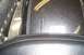 1994 Ford F-150 - A close-up view shows the textured surface of a motorcycle's fender and the stitching on its seat.